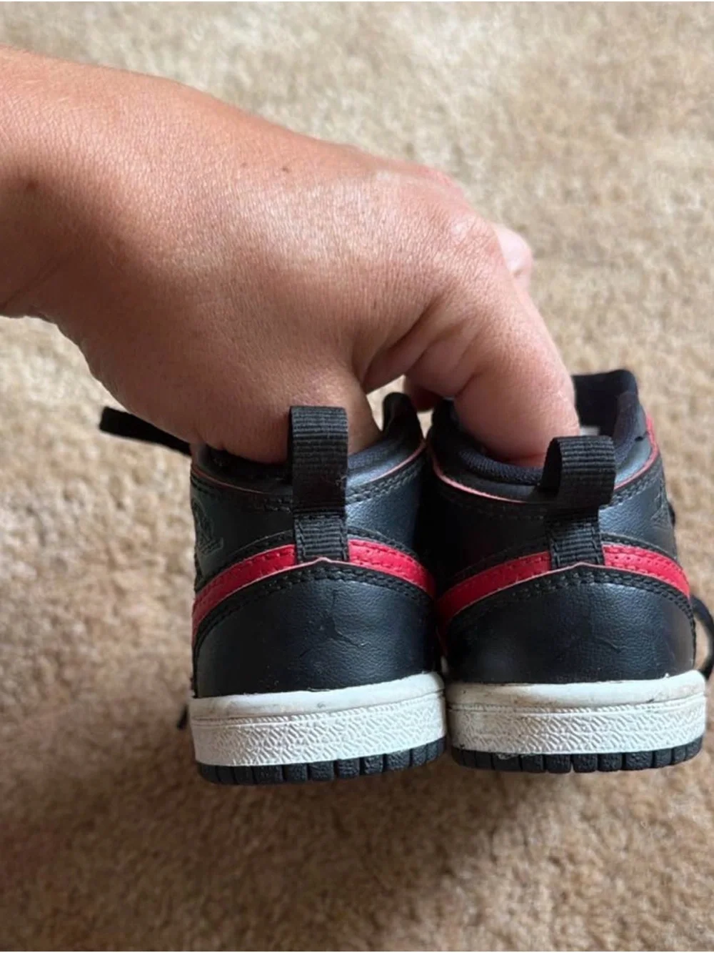Nike Kids Black Sneakers with Red Swoosh